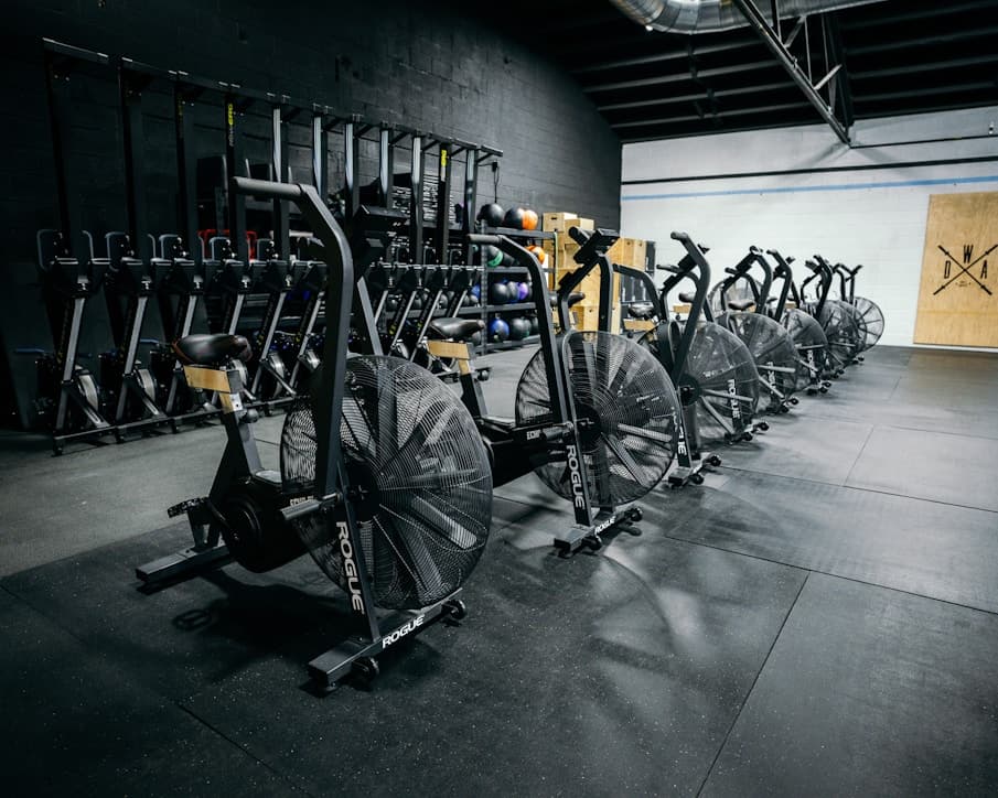 A row of air bikes in a gym